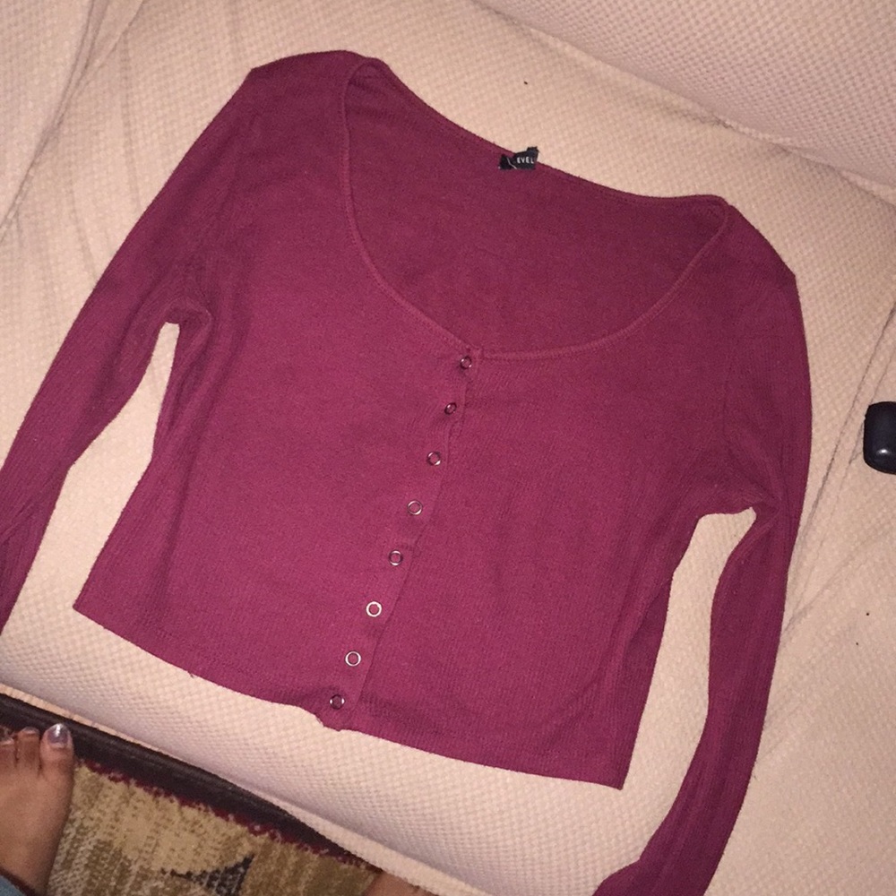 A Burgundy long sleeve crop top